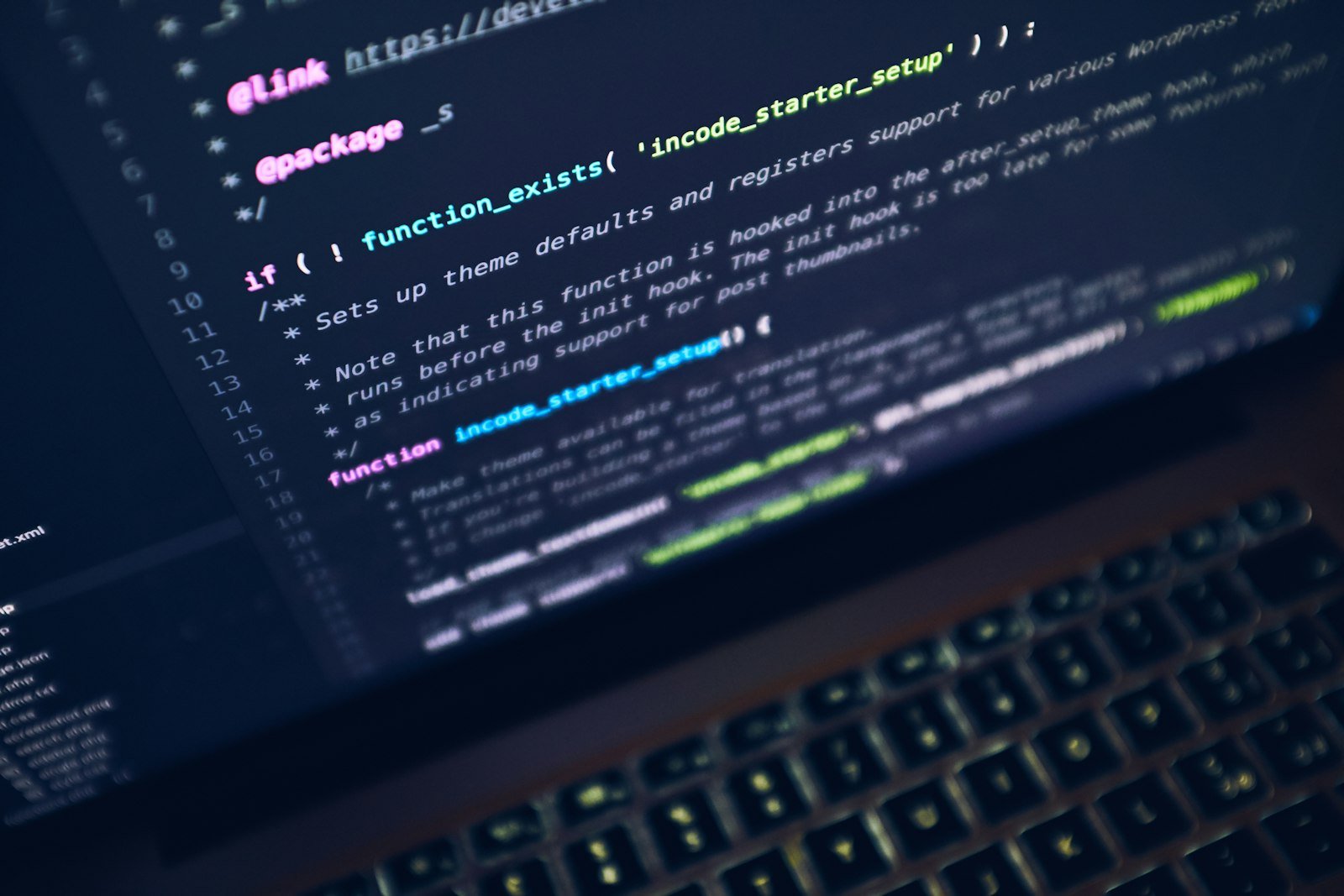 Laptop on a desk with a developer workspace and coffee