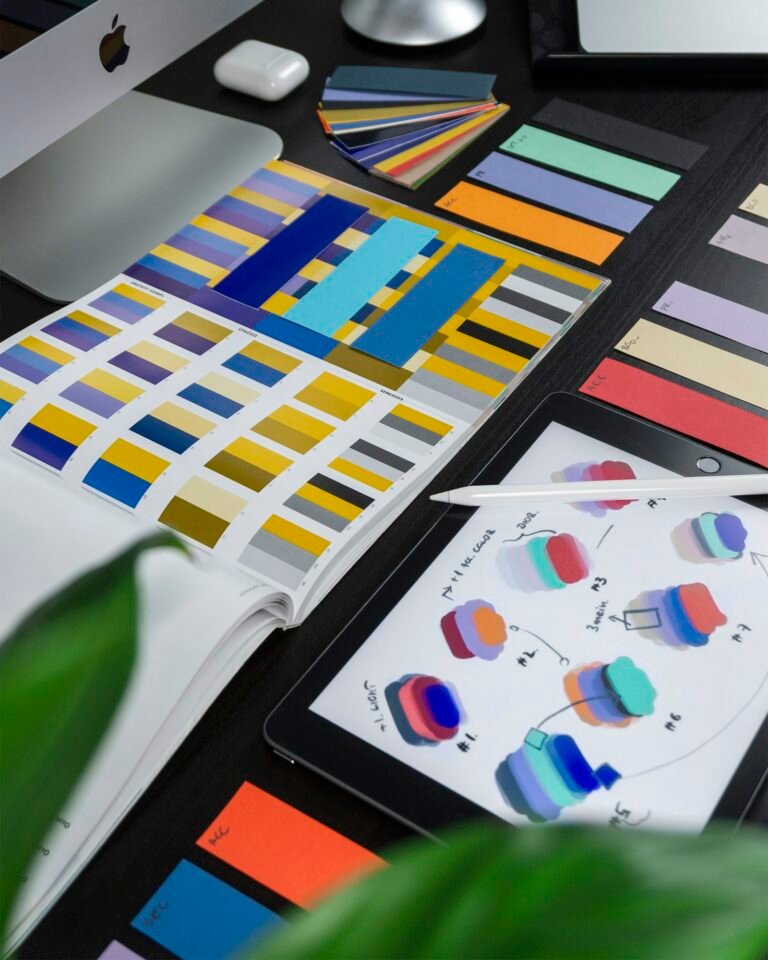 Colorful UI design components on a desk representing Figma motion handoff for developers